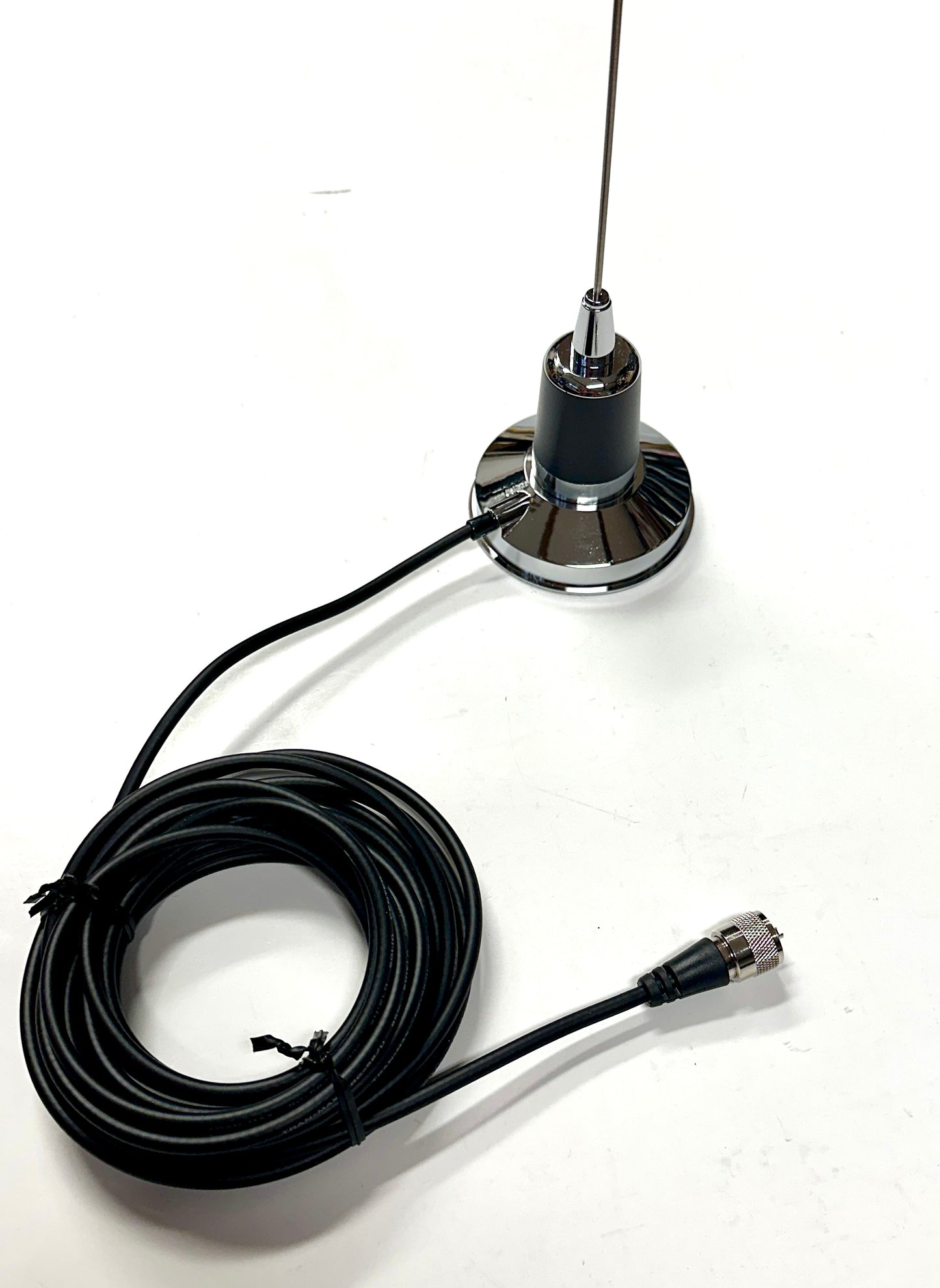 Antenna with a coiled cable on a white background Alberta Radio Supply