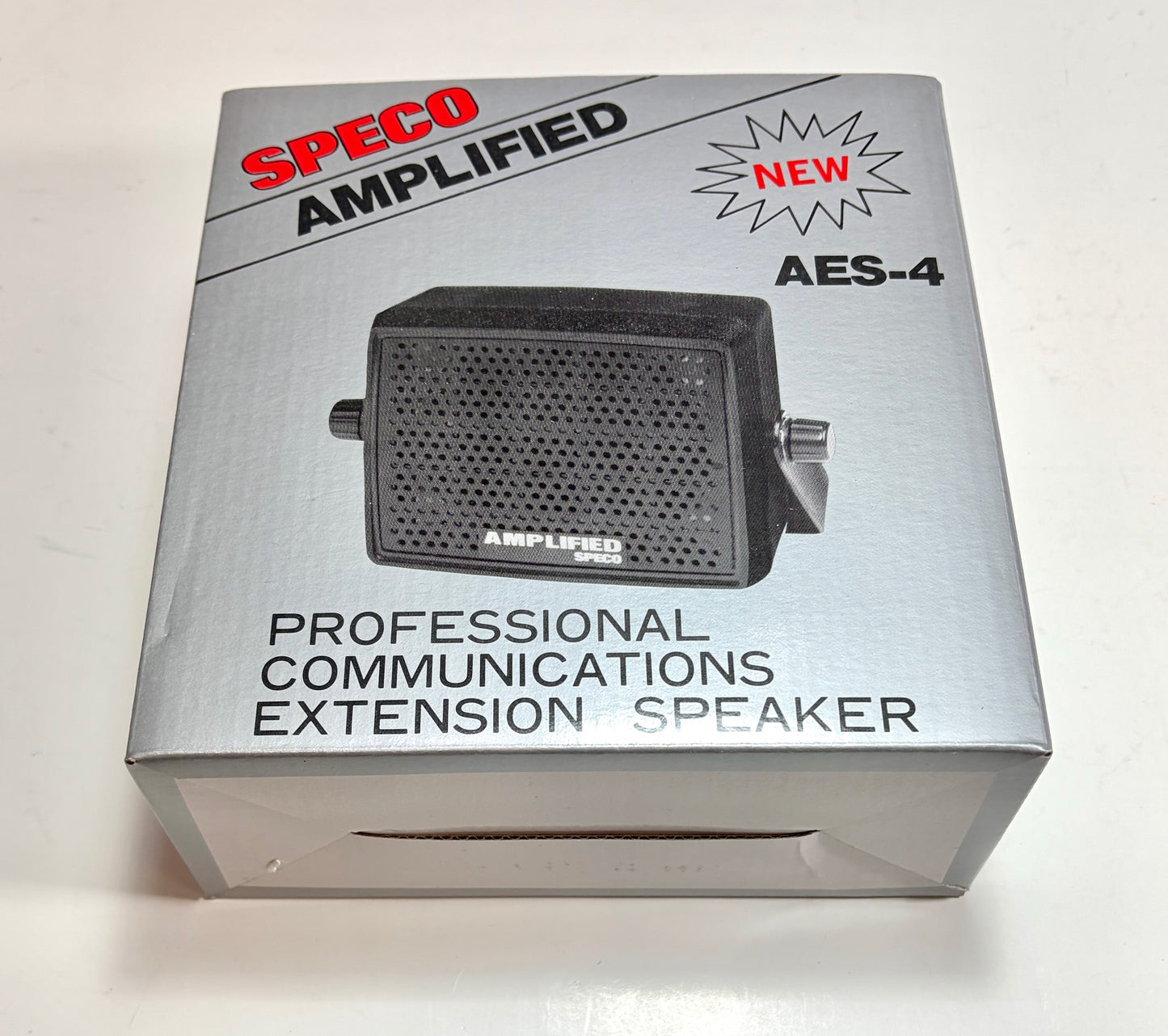 Box of a Speco Amplified professional communications extension speaker on a white background